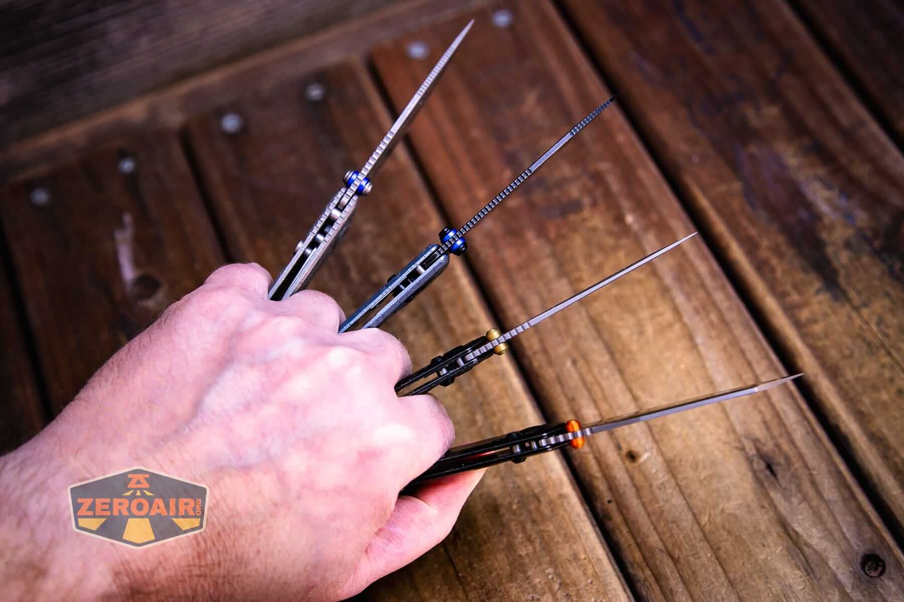 Vosteed Raccoon TiSlim knife with other slims in hand