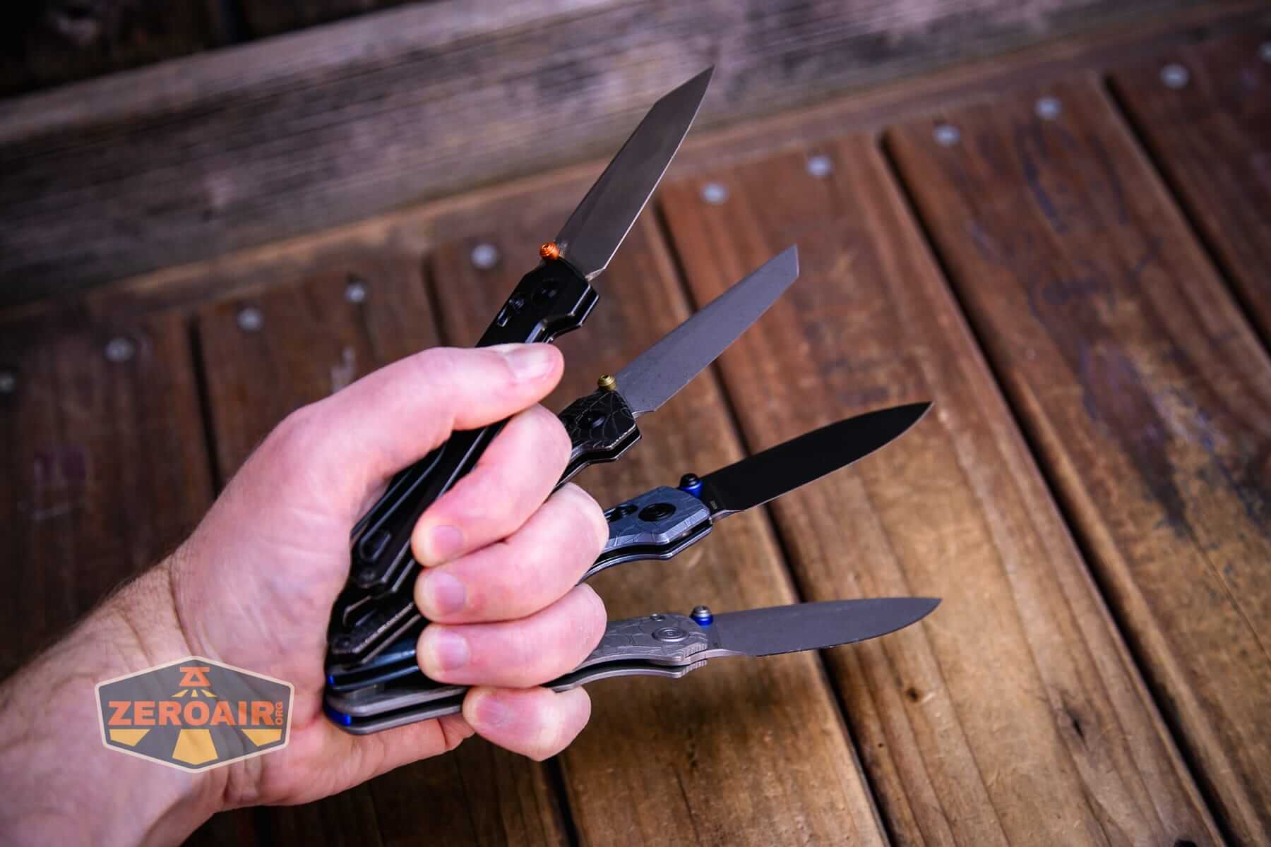 Vosteed Raccoon TiSlim knife with other slims in hand